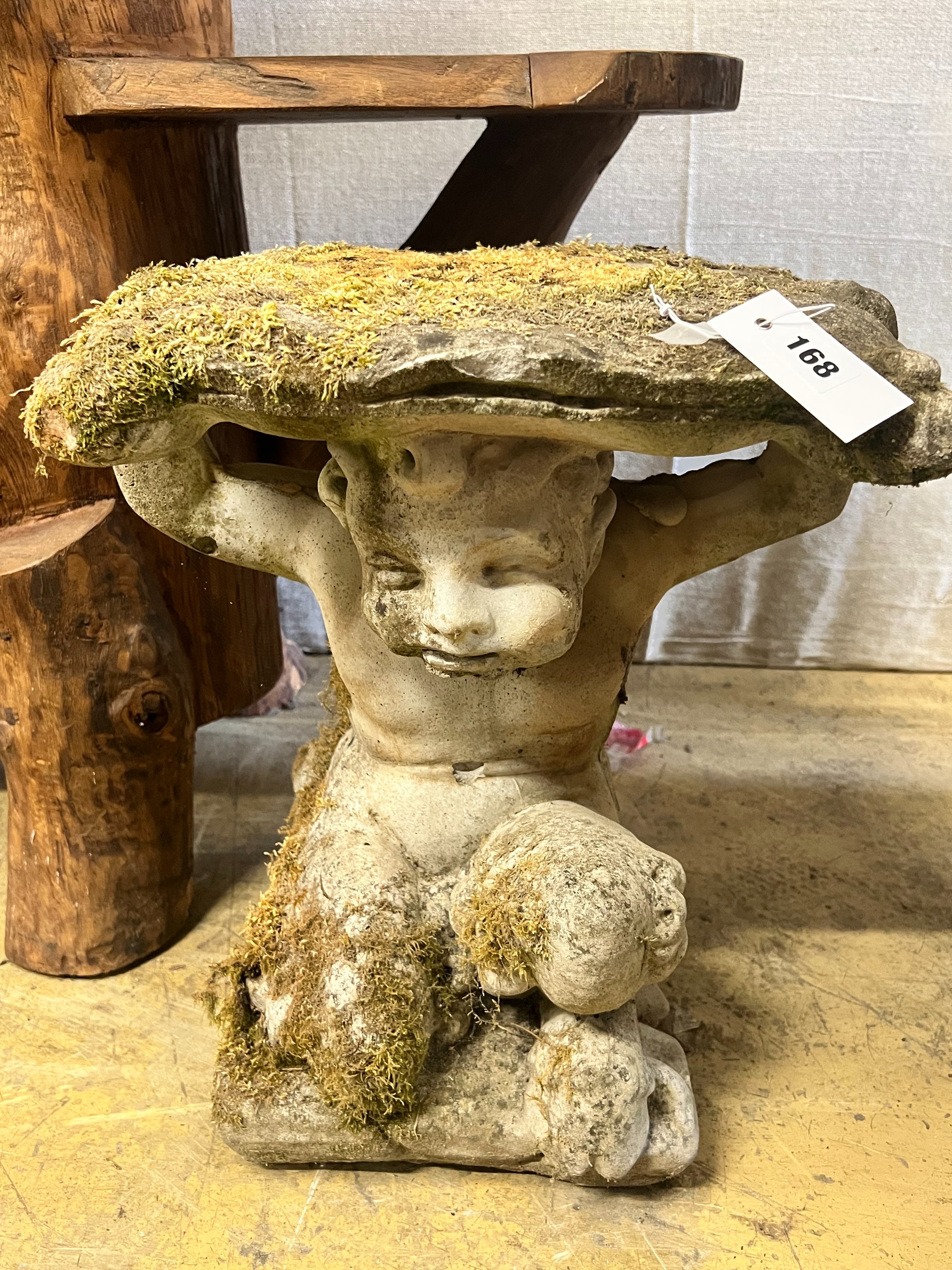 A reconstituted stone Faun garden seat, width 48cm height 46cm
